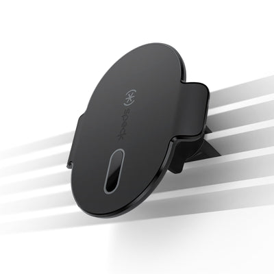 Three-quarter angled view of magnetic car mount attached to dimmed vents to illustrate product in use.